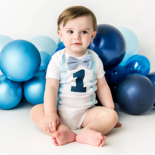Olivia Clothing Store baby boy first birthday outfit with blue bow tie, suspenders, and number one design.
