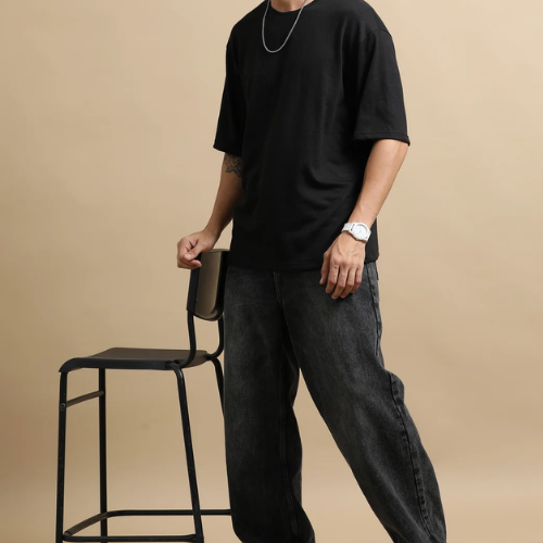 Olivia Clothing Store men’s black oversized T-shirt with relaxed baggy jeans for casual wear.