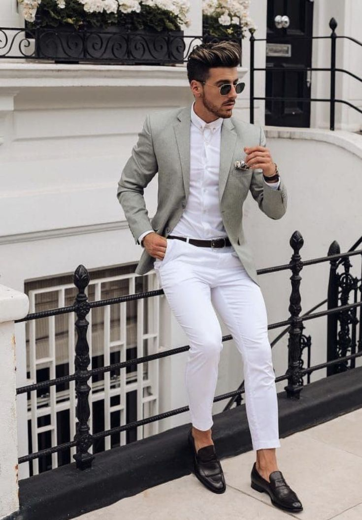 Olivia Clothing Store men's fashion collection featuring a stylish man wearing a light grey blazer, white shirt, white trousers, and formal loafers, showcasing modern smart casual clothing for a premium fashion look.